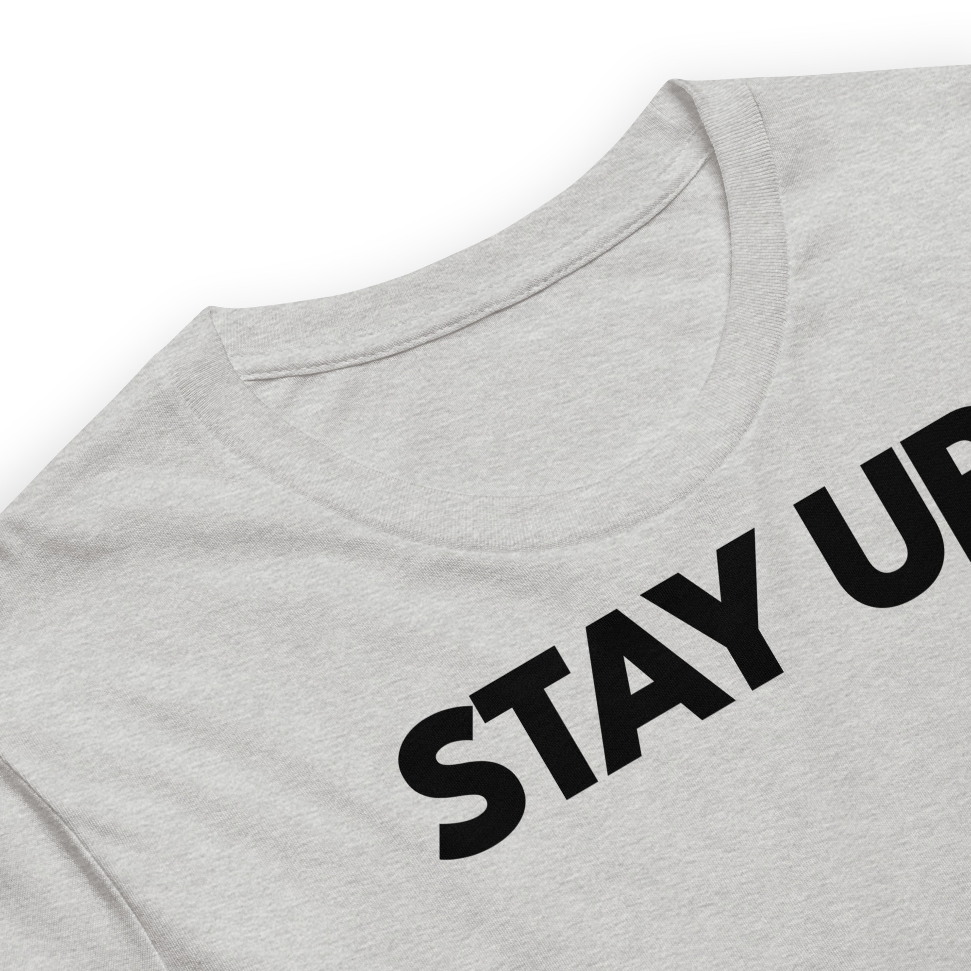 Close-up of the Stay Up t-shirt featuring the bold logo in light colors, showing fabric texture and print quality.
