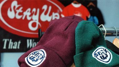 Stay Up branded beanies and tees — streetwear accessories promoting confidence and style